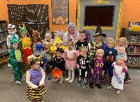 Children dressed in Halloween costumes at the Library