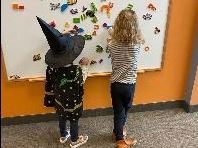 Kids at white board