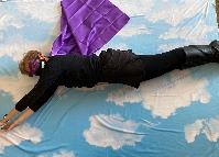 Library Director flying in the air