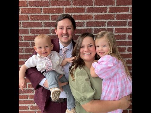 Young couple with two small children